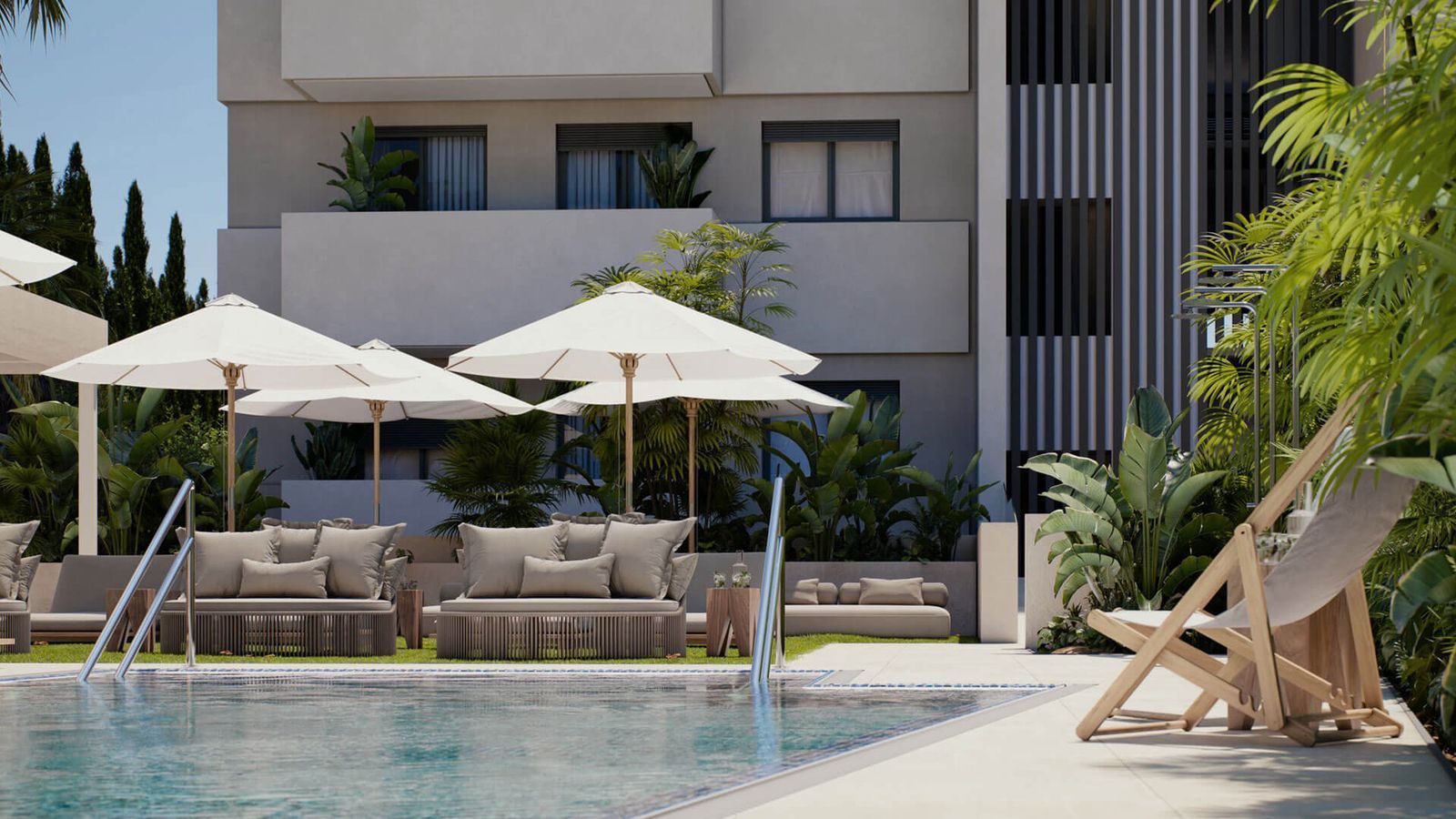 Zwembad bij Las Mesas Sea Suites met ligbedden en parasols.